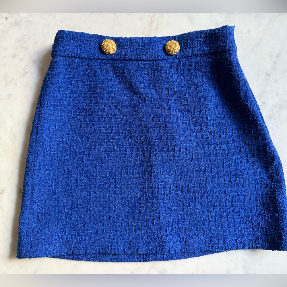 Blue mini skirt with gold buttons